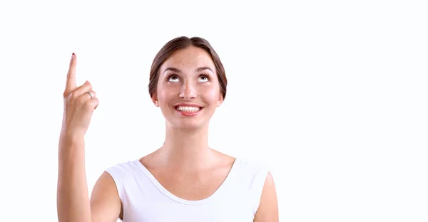 Retrato de una joven sonriente señalando hacia arriba — Foto de Stock