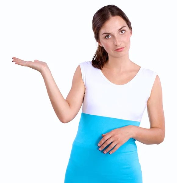 Portrait of a smiling young woman pointing up — Stock Photo, Image