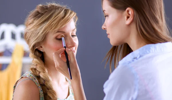 Artist doing professional make up of woman — Stock Photo, Image