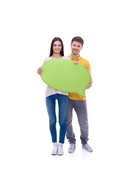 Retrato de una joven informal con tarjeta en blanco sobre fondo blanco . —  Fotos de Stock