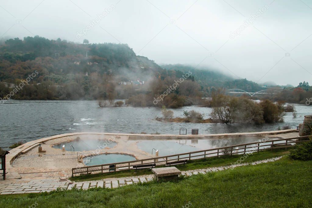 Hot springs Muino da Veiga, pools in Minho riverbed in Ourense, Spain