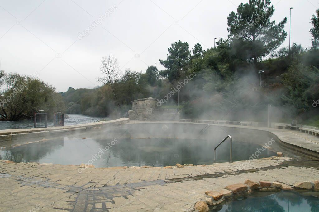 Hot springs Muino da Veiga, pools in Minho riverbed in Ourense, Spain