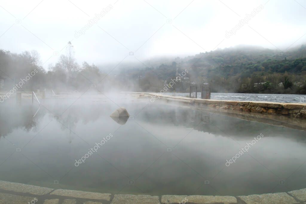 Hot springs Muino da Veiga, pools in Minho riverbed in Ourense, Spain