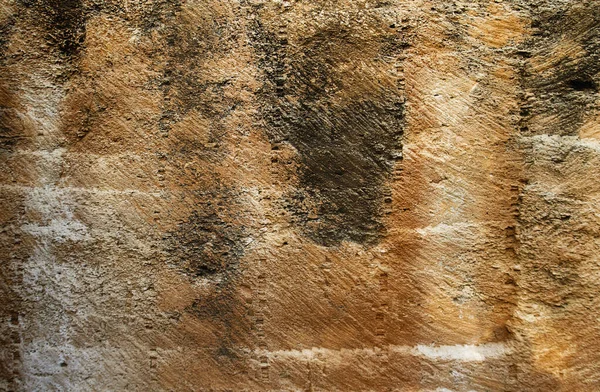 ラフで多孔質の砂岩採石場の壁のテクスチャの詳細 — ストック写真