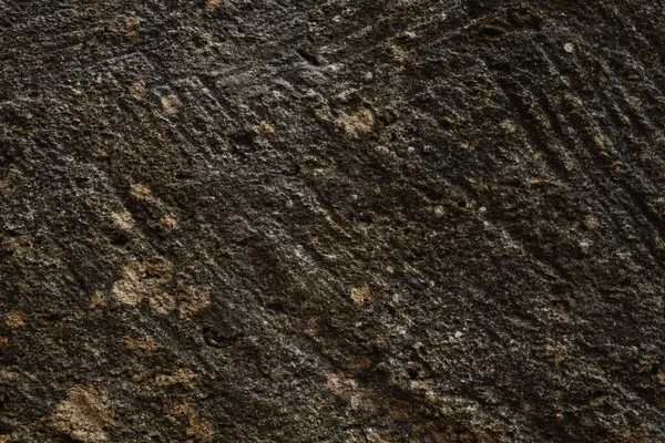 ラフで多孔質の暗い砂岩の壁のテクスチャの詳細 — ストック写真