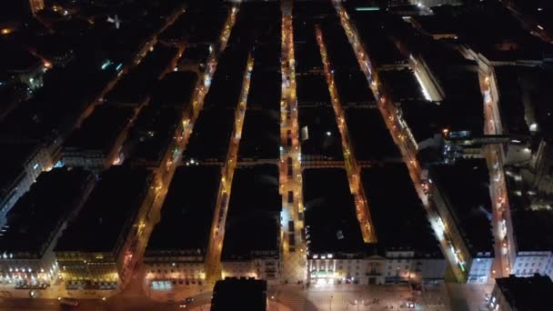 Aerial view of rooftops of houses in organized rows in Lisbon, Portugal at night — Video