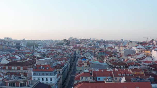Aerial dolly in view of rooftops of colorful houses in Lisbon historical old city center in Portugal — Stock Video