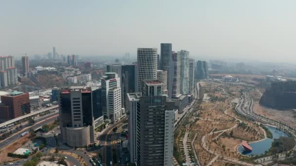 Aerial drone view modern tall buildings group in Santa Fe town district. Cámara volando de derecha a izquierda. Ciudad de México, México. — Vídeo de stock