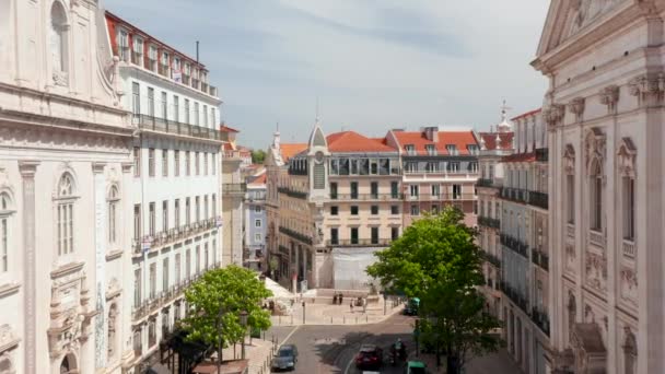 Aerial dolly in street view of traditional European houses and people living daily lives in urban city center of Lisbon, Portugal — Stock Video