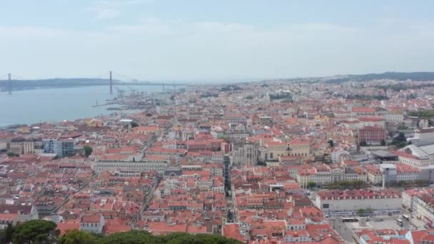 Ascending wide panoramic aerial reveal of Lisbon cityscape with densely packed traditional colorful houses with red roofs in Lisbon city center — Stock Video