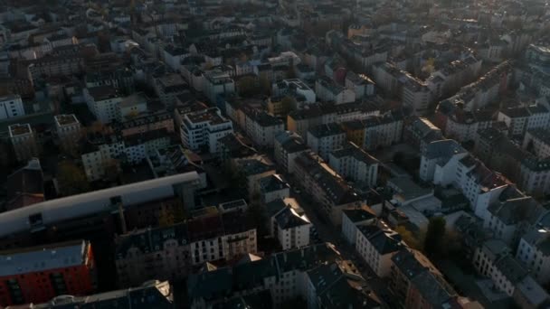 Aerial view of buildings and streets of Bornheim neighbourhood. Tilt up revealing skyline with group of skyscrapers downtown. Frankfurt am Main, Germany — Stock Video