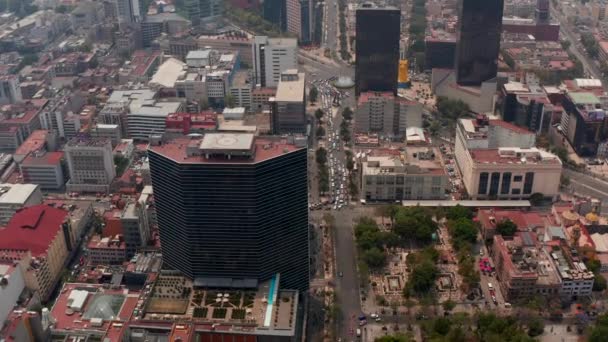 Forwards reveal of city streets. Aerial view of downtown cityscape with high variety of buildings. Mexico City, Mexico. — Stock Video