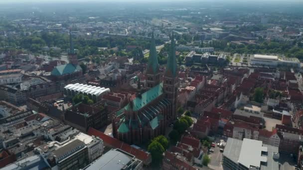 Aerial panoramic footage of historic part of town. Showing St. Marys Church, St. Peters Church and in distance Luebeck Cathedral. Luebeck, Schleswig-Holstein, Germany — Stock Video
