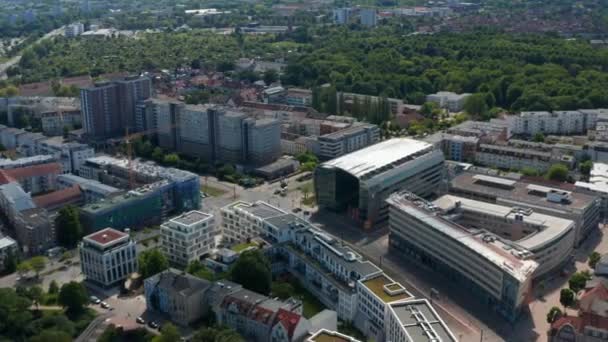 Panorama curve shot of residential neighbourhood. Multilane road and tram tracks leading through housing estate — Stockvideo