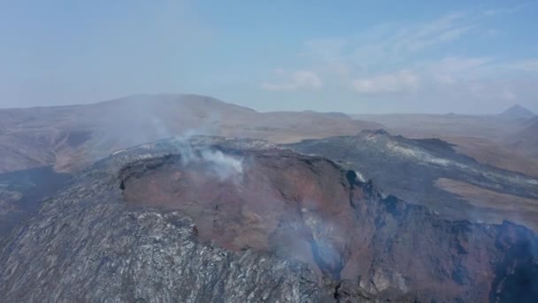 Striking air view circling around Fagradalsfjall smoky crater cone, Iceland, day — Stock video