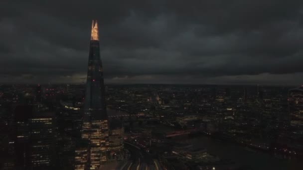 The Shard skyscraper in London city, UK. Aerial drone view of capital cityscape at night, dolly in — Stock Video
