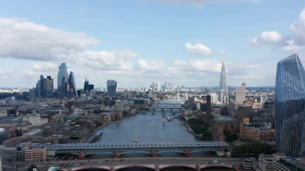 Aerial view of modern downtown skyscrapers mixed with traditional buildings along Thames river. Revealing of Blackfriars bridges. London, UK — Stock Video