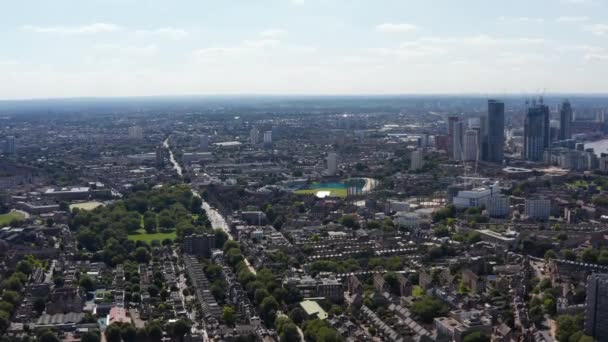 Forwards fly above Kennington urban borough. Aerial panoramic view of residential houses, The Oval stadium and group of skyscrapers. London, UK — Stock Video