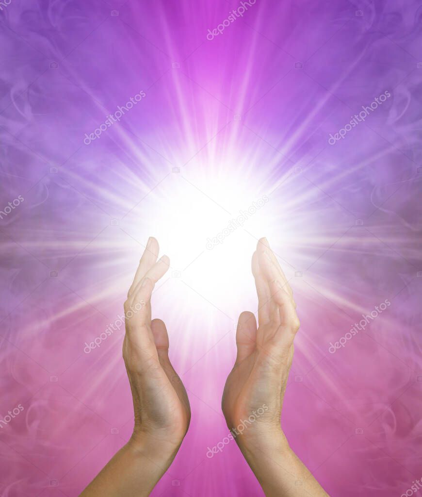 Ask and it is Given - sending healing out where it is needed - Female hands reaching up into a white star light radiating outwards on a pink purple ethereal background with copy space below