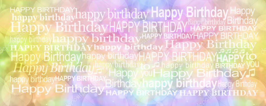 Happy Birthday Message Background Banner - rainbow coloured bokeh background with many different sized white 'HAPPY BIRTHDAY' words arranged to fill the space