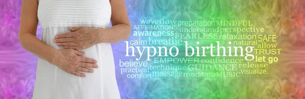 The Benefits of Hypnobirthing Word Cloud - female in white dress with hands across stomach beside a HYPNOBIRTHING word cloud on a rainbow coloured wispy pattern background