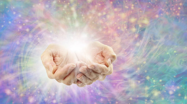 Энергия эфирного нагрева, излучаемая руками - женские руки с белым светом на фоне вращающейся искры разноцветной энергии и места для текстовых сообщений