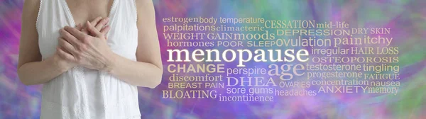 Words associated with the Female Menopause - mature female with hands across chest beside a MENOPAUSE word cloud on a purple green multicoloured abstract background