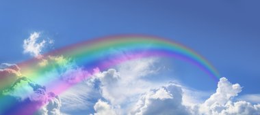 Rainbow on wide blue sky clipart