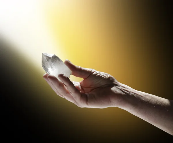 Cleansing Terminated Quartz Wand in Golden White Light Royalty Free Stock Images