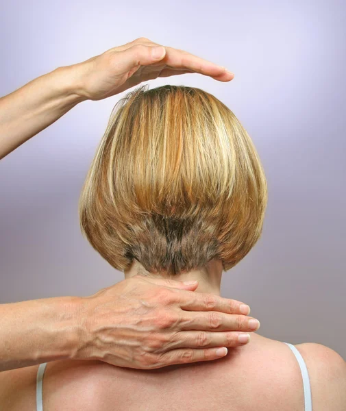 Demonstrating hand positions for channeling healing