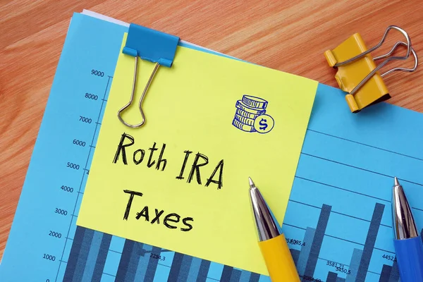 Financial concept meaning Roth IRA Taxes with sign on the sheet
