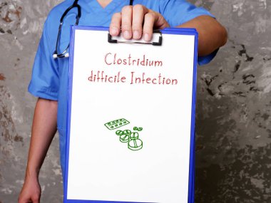 Medical concept meaning Clostridium difficile Infection with phrase on the piece of paper clipart