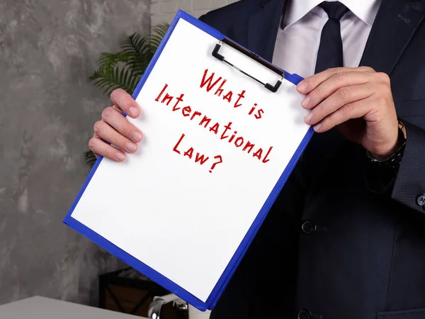 Juridical concept meaning International Law? with inscription on the piece of paper