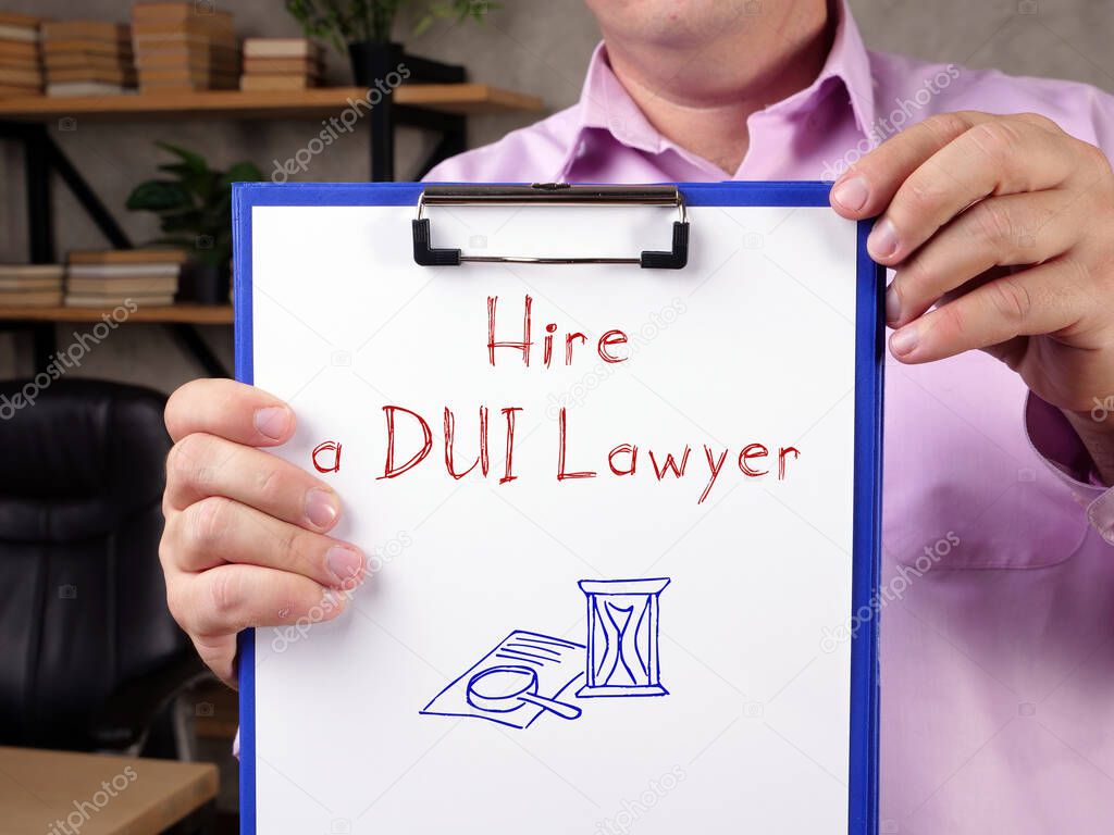 Business concept about Hire a DUI Lawyer with inscription on the sheet