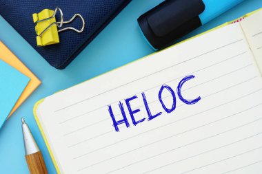 Business concept about HELOC with inscription on the piece of paper clipart