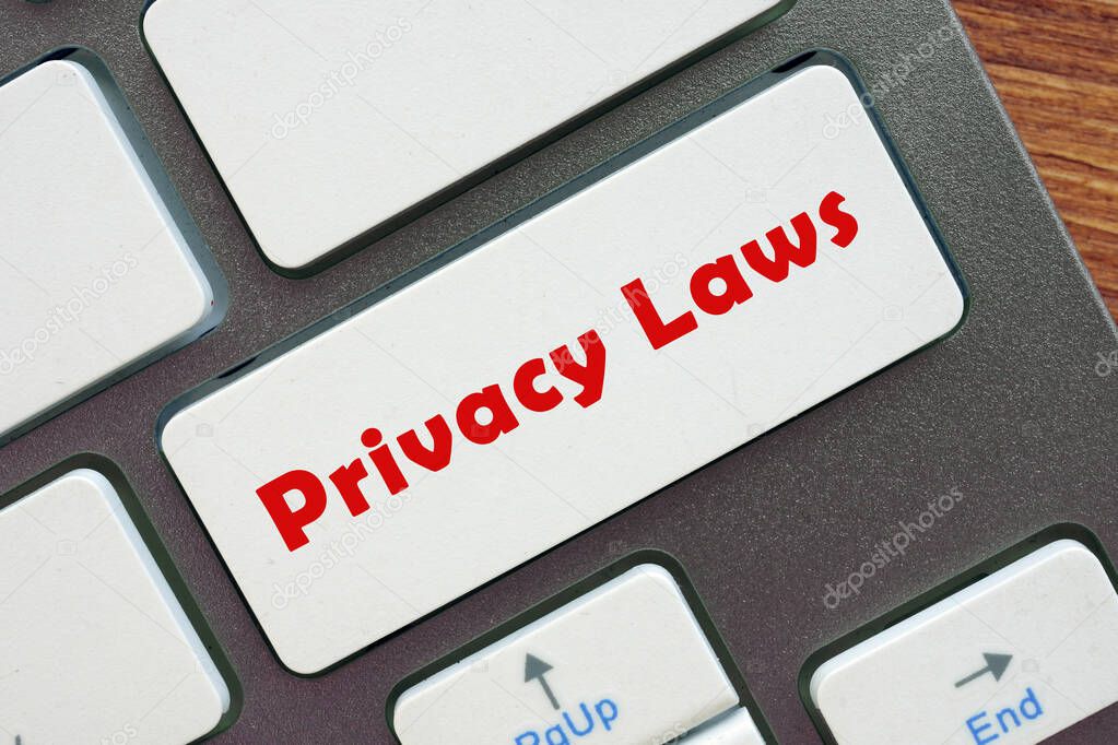 Business concept meaning Privacy Laws with phrase on the piece of paper