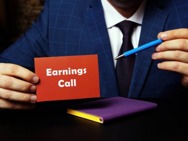Financial concept meaning Earnings Call with phrase on blank business card in hand clipart