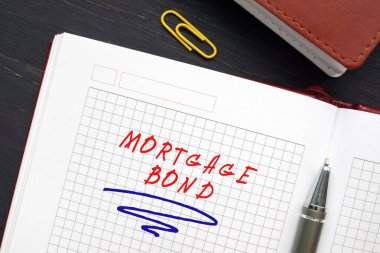 Finansal konsept: MortGage BOND. Tabela ile birlikte. Mortgage tahvili, gayrimenkul varlıkları üzerinde teminat olarak hak iddia eden kişilerin tahvili.