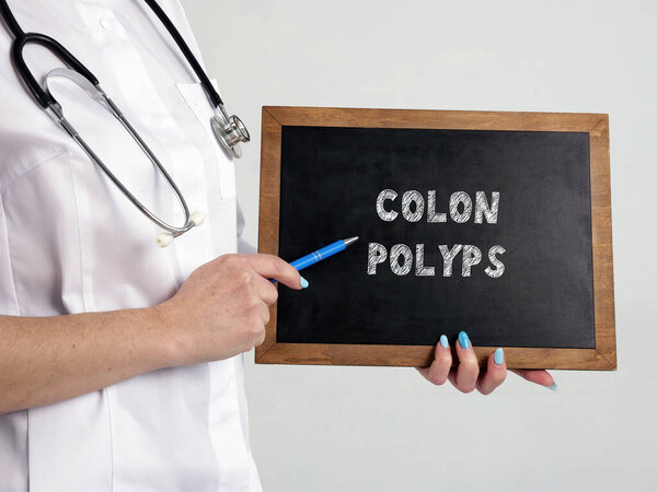 Healthcare concept meaning COLON POLYPS with phrase on the chalkboard