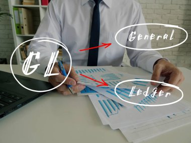 Conceptual photo about GL General Ledger with written note.Man signing document on background clipart