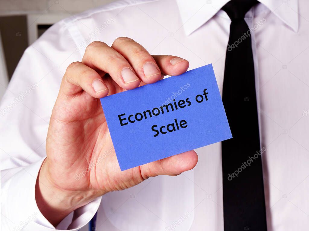  Financial concept meaning Economies of Scale with sign on the sheet