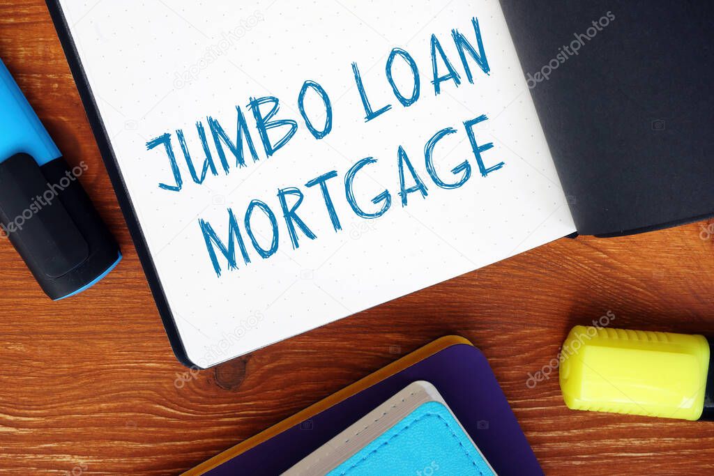 Business concept meaning JUMBO LOAN MORTGAGE exclamation marks with inscription on the sheet.