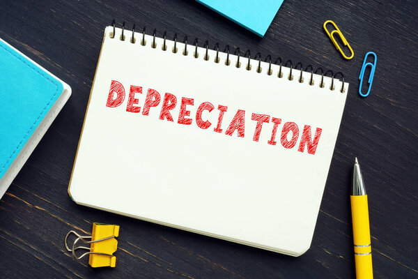 Conceptual photo about DEPRECIATION with handwritten phrase. An accounting method of allocating the cost of a tangible asset over its useful lif