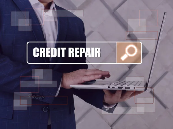 CREDIT REPAIR text in search line. Broker looking for something at computer.