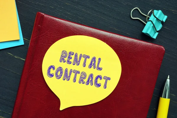 Business concept meaning RENTAL CONTRACT with inscription on the piece of paper.