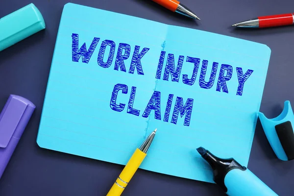 Business concept about Work Injury Claim with inscription on the page.