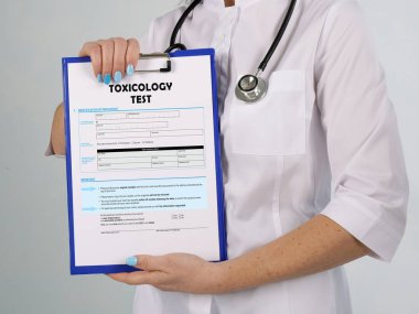 Healthcare concept about TOXICOLOGY TEST with phrase on the sheet clipart