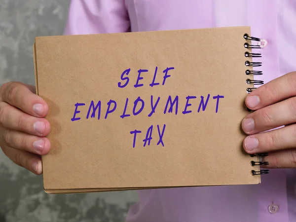 SELF EMPLOYMENT TAX sign on the sheet.
