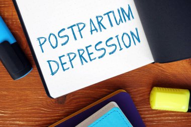 POSTPARTUM DEPRESSION ünlem işaretleri hakkında el yazısıyla yazılmış bir fotoğraf.