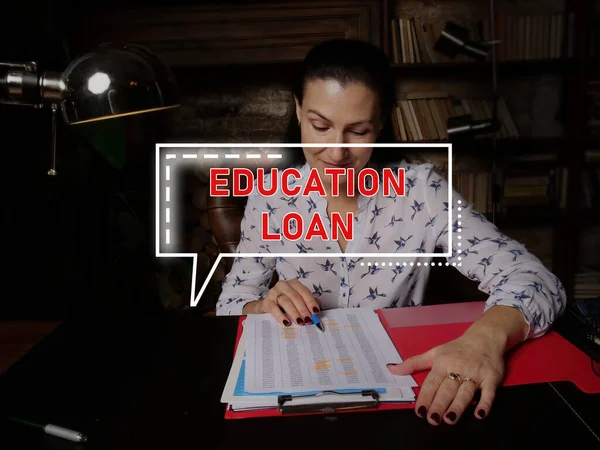 EDUCATION LOAN text in block of quotes. Businesswoman doing paperwork